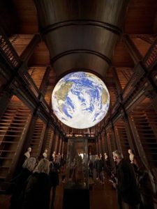 a long room with giant globe